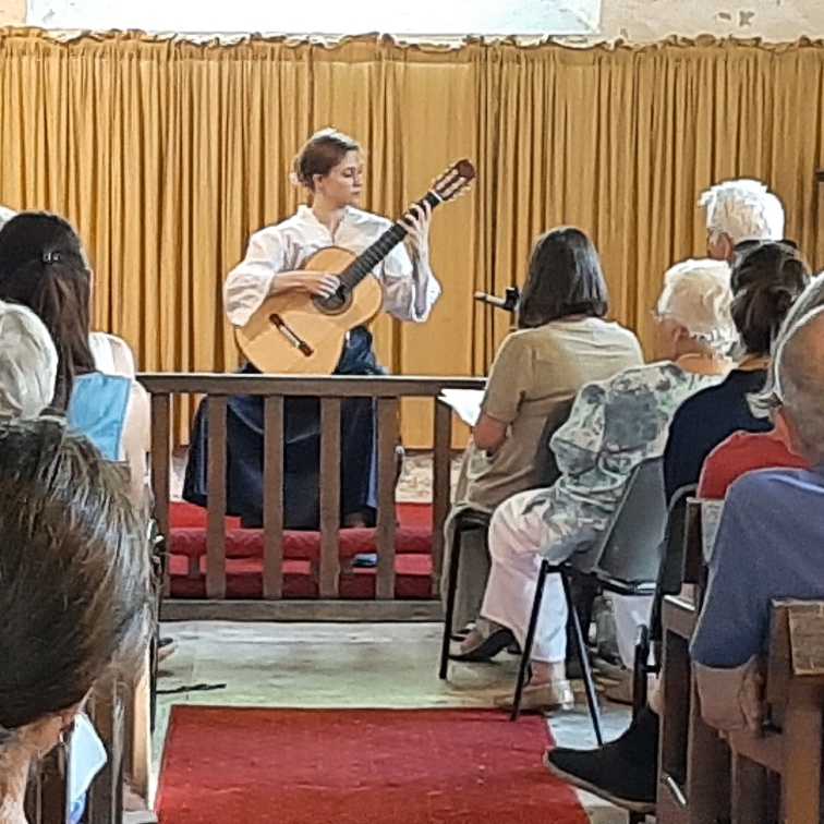 Herefordshire classical guitar student Hope Cramsie performing in St Mary's church, Craswall 2021